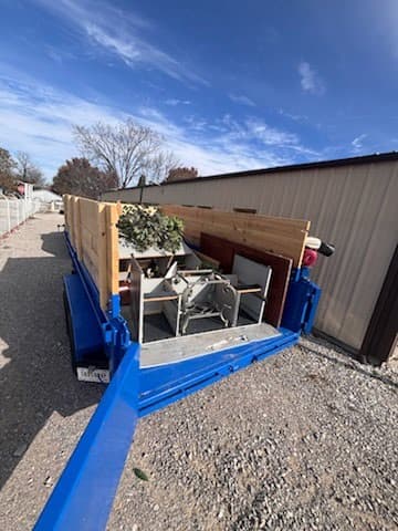 Full dump trailer loaded — rear view with gate open